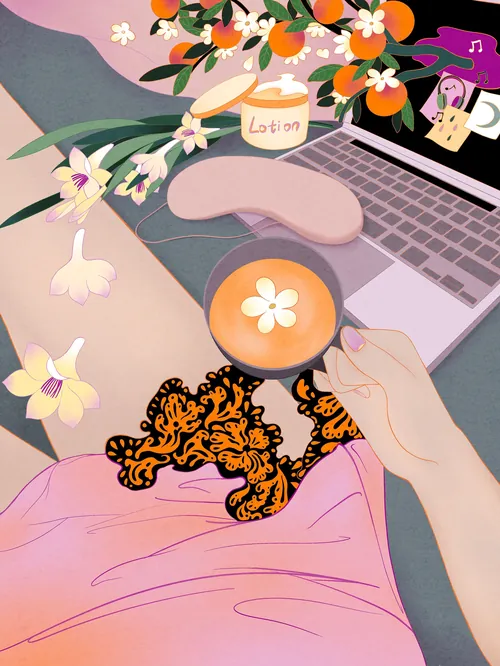 Hand holding coffee cup with flower design near laptop and flowers by Leah Han