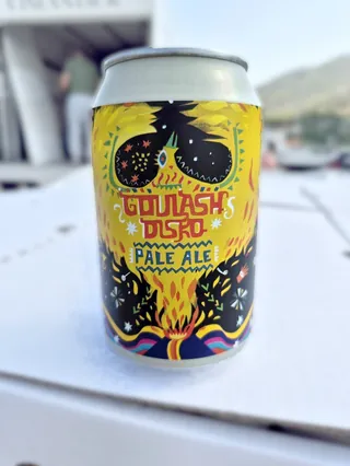 Colorful festival-style beer can with bold graphic design