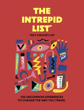 Colorful abstract shapes with bold text on red travel book cover