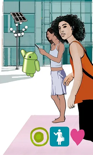 Women interacting with a green Android robot near solar panels by Lennart Andresen