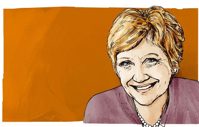 Smiling woman with short hair and pearl necklace on orange background