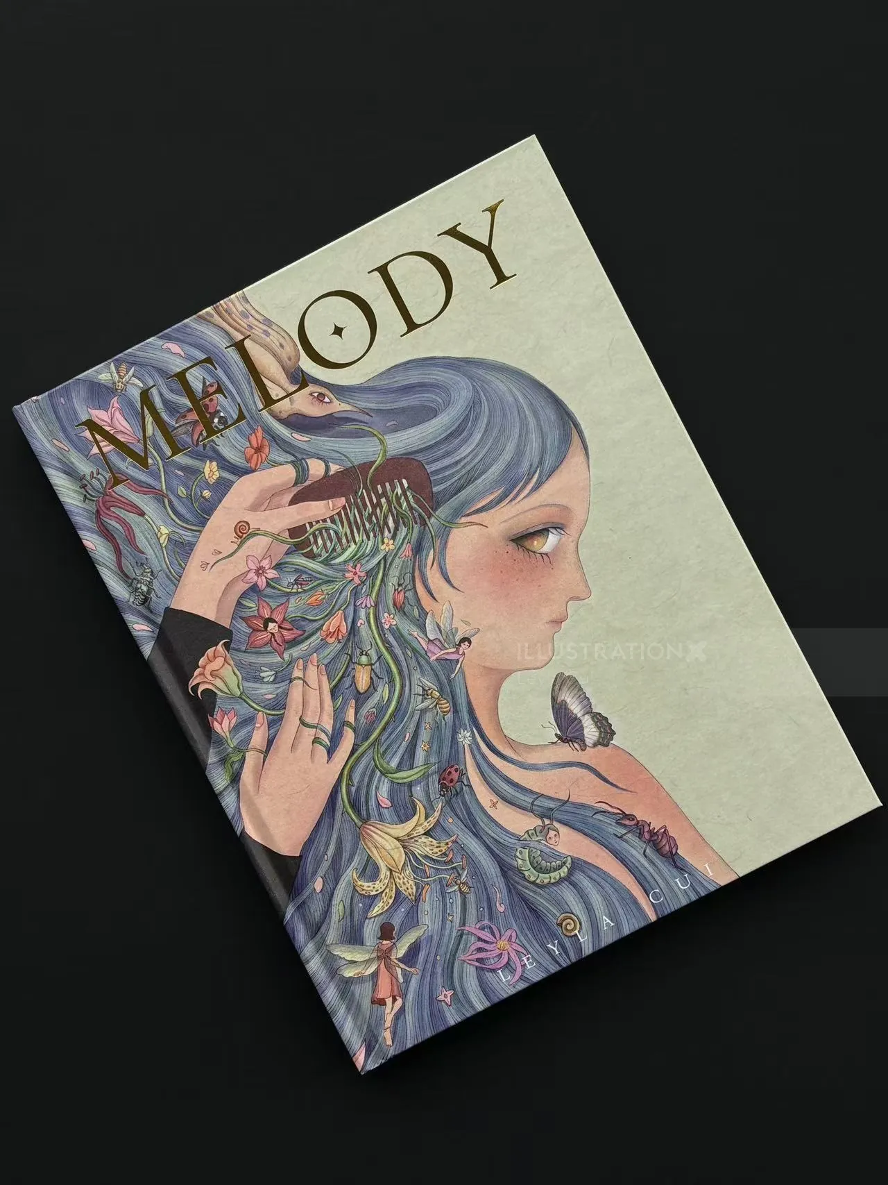 Cover of Melody artbook with blue-haired girl and small animals by Leyla Cui