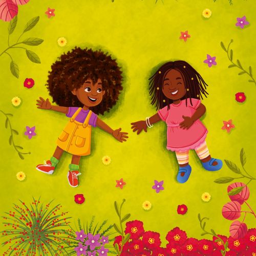 Two happy children lying on green grass with flowers around