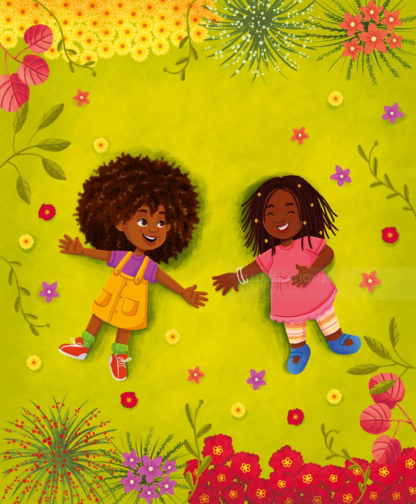 Two happy children lying on green grass with flowers around