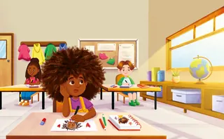 Kids drawing at desks in sunny classroom with globe and colorful coats