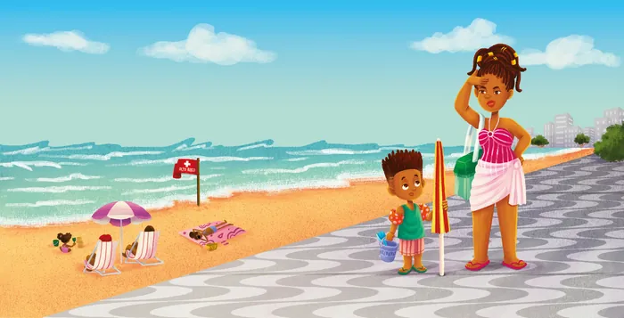 Mother and child standing on beach promenade with ocean view