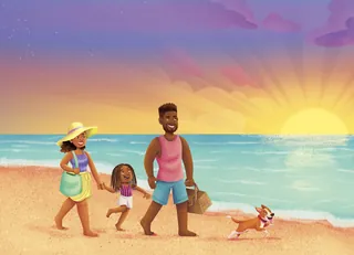 Happy family walking along the beach at sunset with their dog