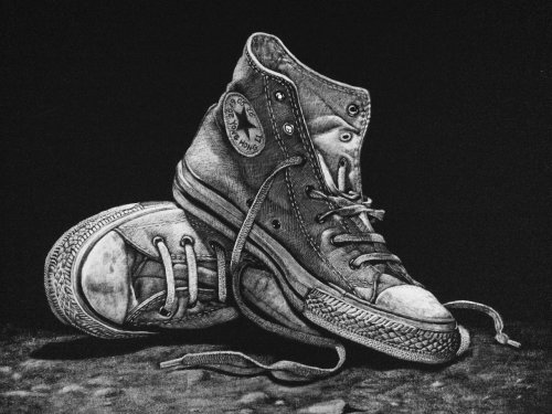 Black and white drawing of sneakers shoes