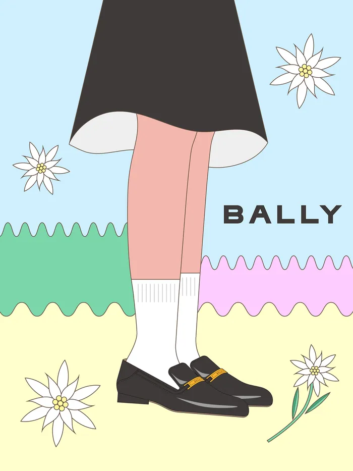 Legs wearing black Bally loafers and socks with flowers