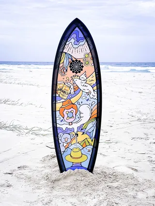 australiana theme surfboard on the beach
