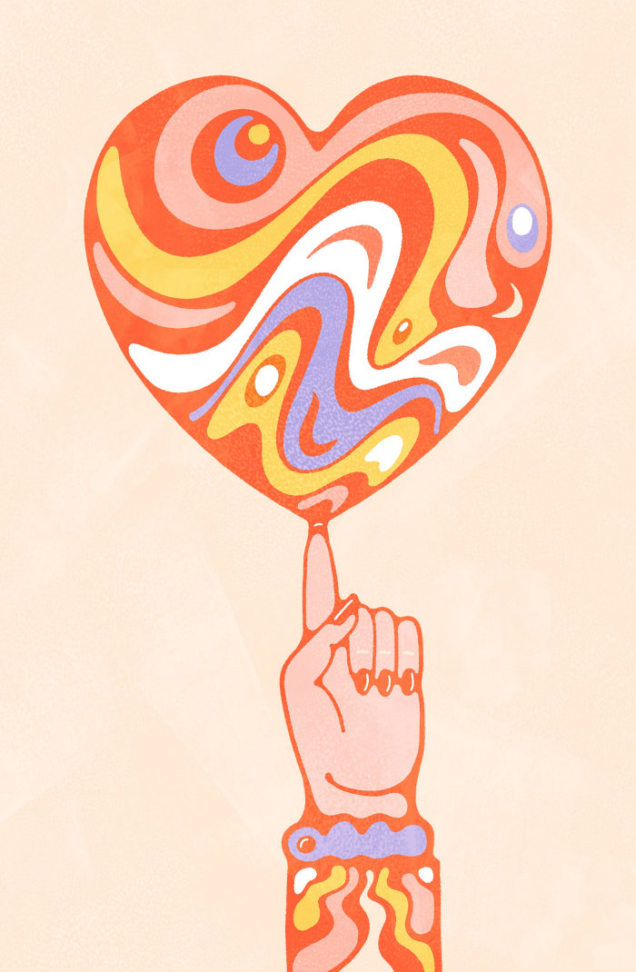 Psychedelic swirling heart in vibrant colours, balancing on female fingertip