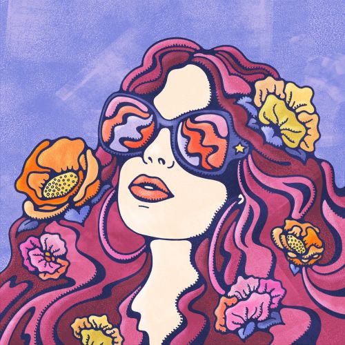 Female gazing at the summer sun with sunglasses on, flowers in her luscious wavy hair.