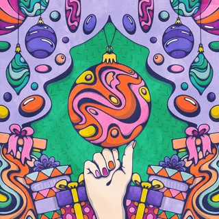 Hand balancing a colorful Christmas ornament amid hanging ornaments and gifts by Lively Scout