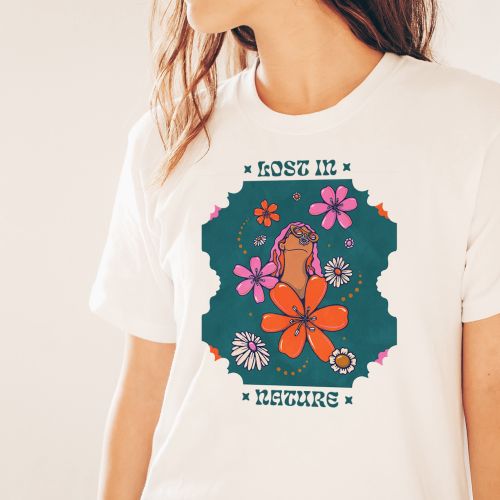 Woman in white t-shirt with colorful floral design and 'Lost Leisure' text by Lively Scout