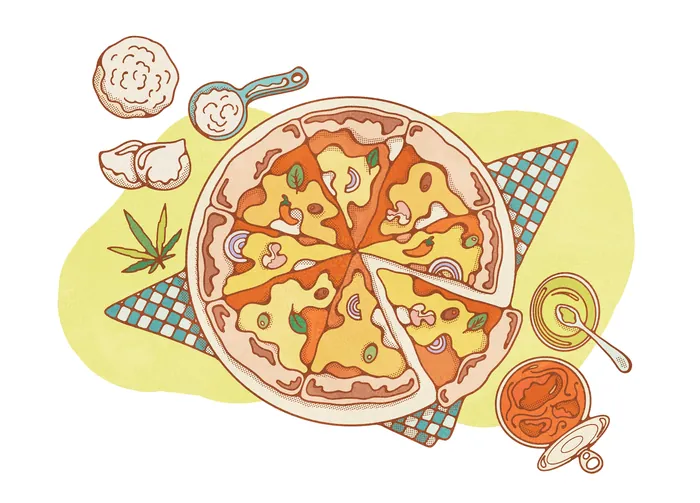 Sliced pizza on checkered napkin with condiments around