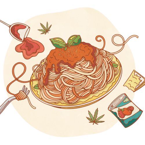 Spaghetti with tomato sauce and basil on plate with scattered ingredients