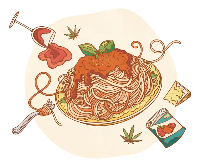 Spaghetti with tomato sauce and basil on plate with scattered ingredients