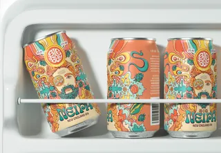 Three vibrant beer cans with artistic illustrations inside a refrigerator