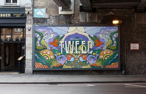 Bright mural with text welcoming to Tweed and decorative flowers and patterns