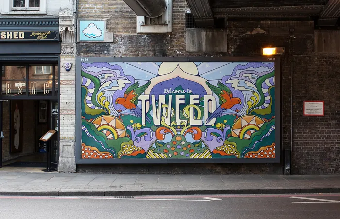 Bright mural with text welcoming to Tweed and decorative flowers and patterns