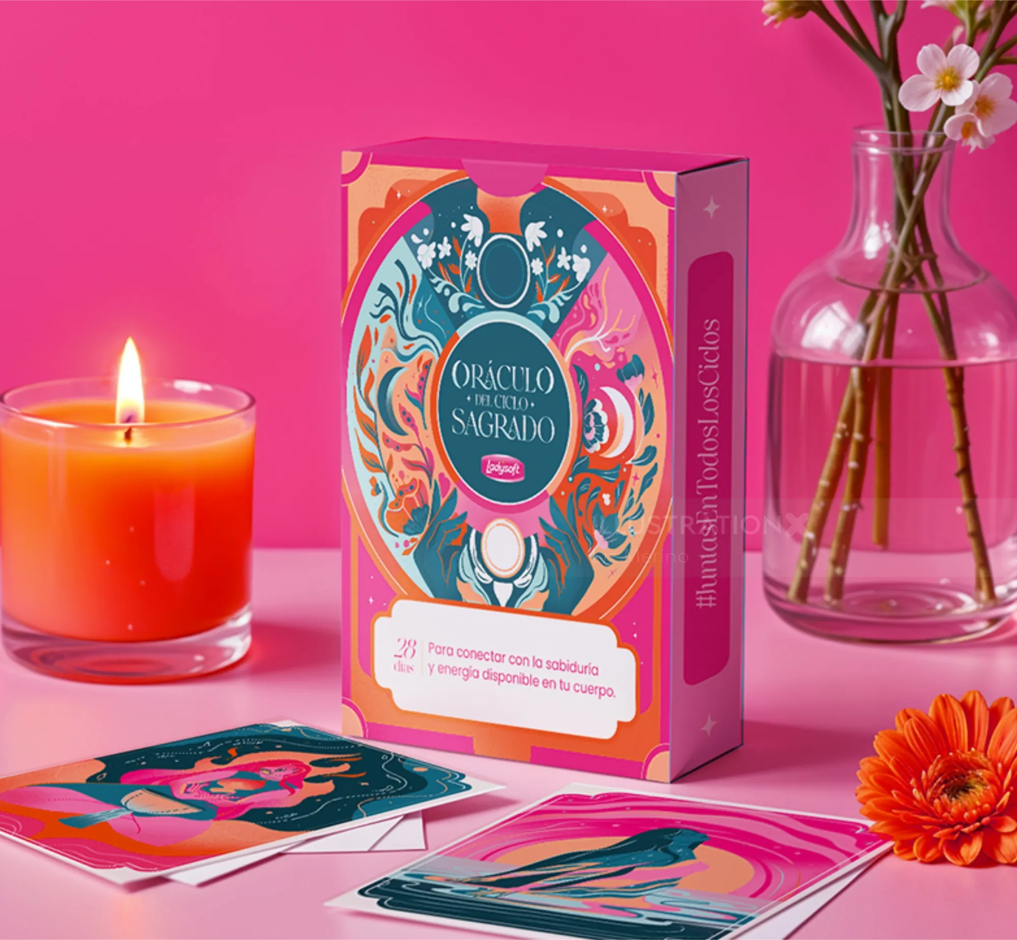 Liz Merino's Oráculo del Ciclo Sagrado card deck with candle and flowers