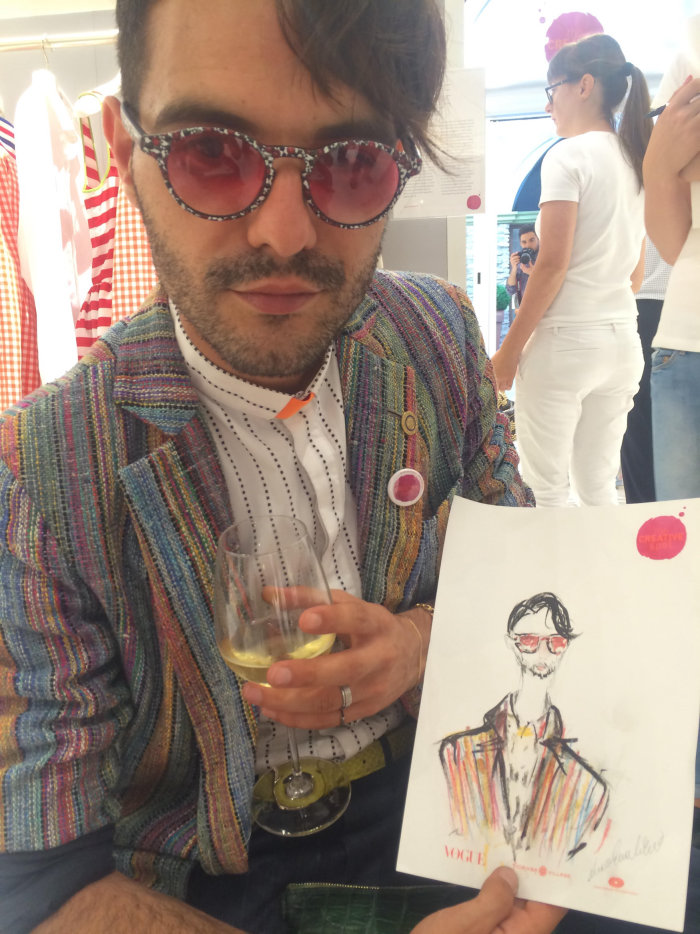live event drawing of man with his art