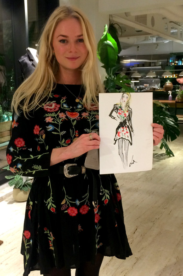 Live event drawing womain with black floral dress
