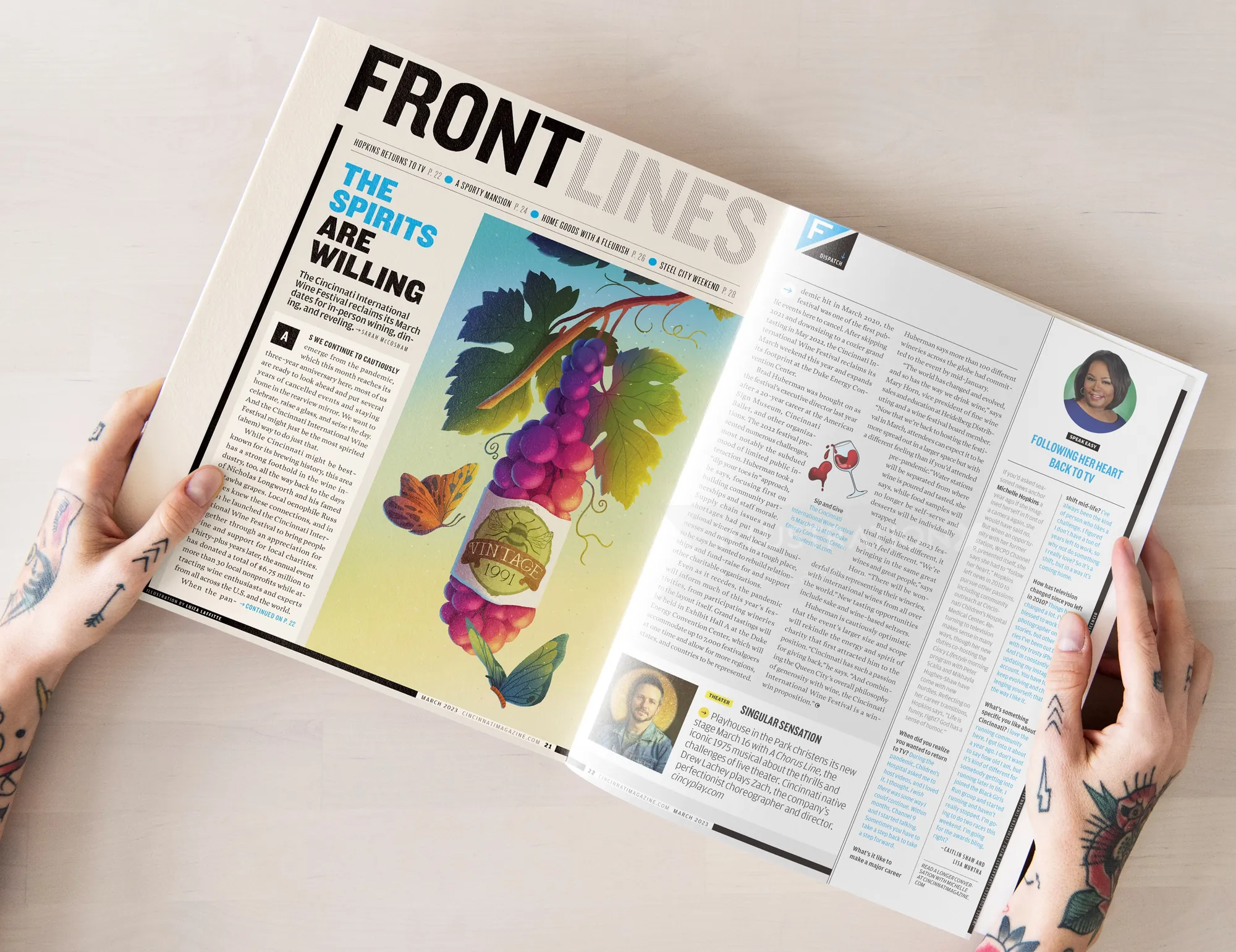 Illustration of a wine bottle and grapes in magazine layout by Luiza Laffitte