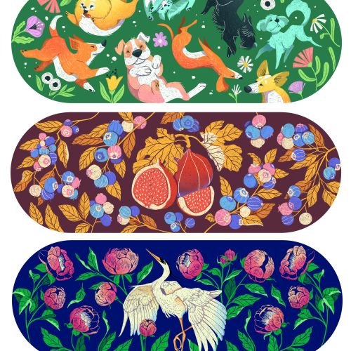 Three skateboard decks with dogs, fruit, and cranes artwork