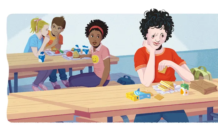 Students sitting at cafeteria tables eating and talking