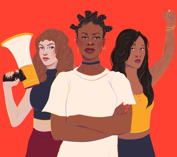 Three diverse women standing with confident expressions and raised fists