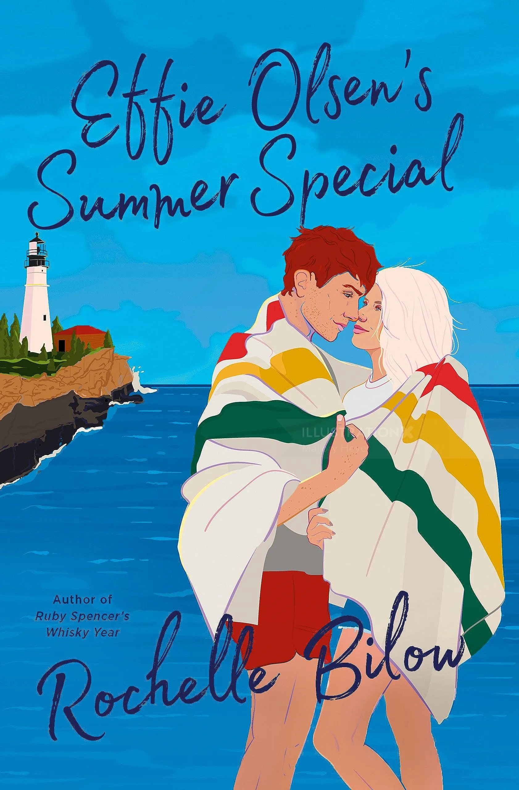 Couple wrapped in striped blanket standing near lighthouse by ocean