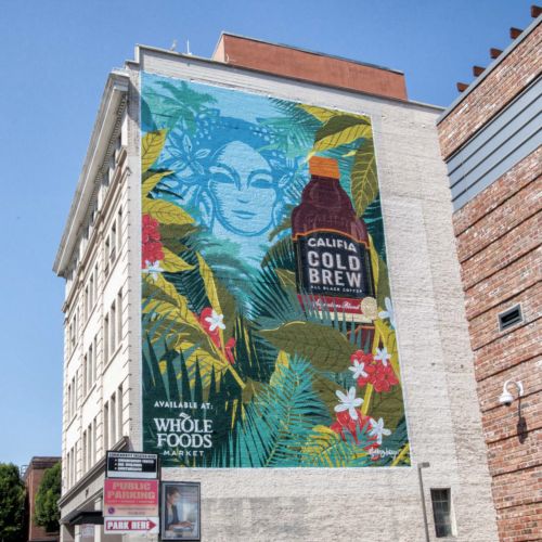 Mural of Califia Cold Brew bottle and tropical leaves on building exterior