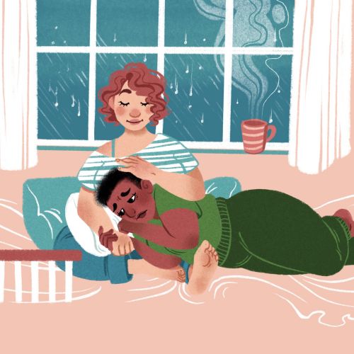 Two people relaxing indoors on rainy day with steaming cup by Manu Cunhas