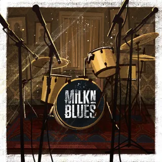Drum set with Milk'n Blues logo on bass drum in vintage room