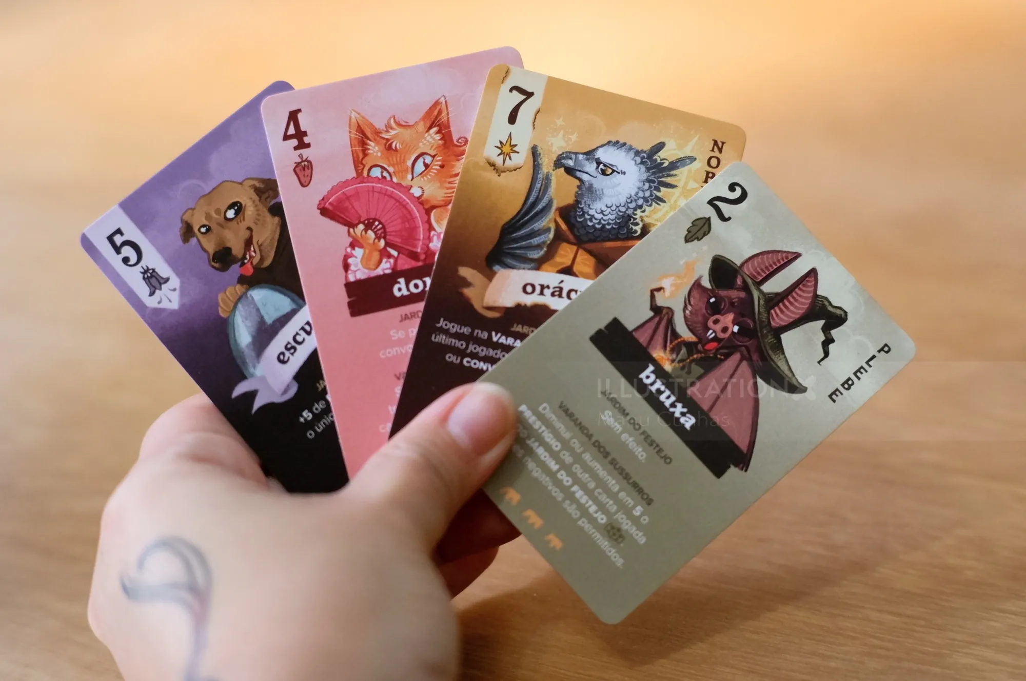 Manu Cunhas animal oracle cards held in a hand