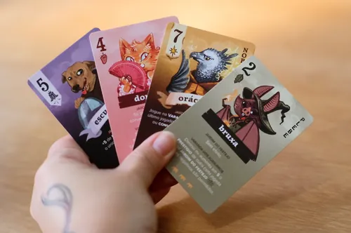 Manu Cunhas animal oracle cards held in a hand