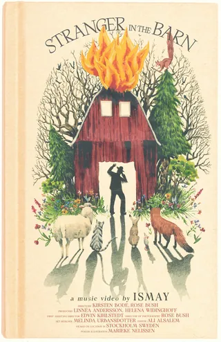 Barn on fire with person silhouette and surrounding forest animals
