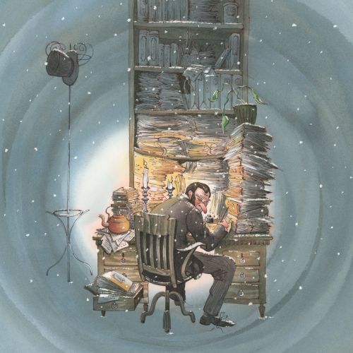 Man sitting at desk reading by fireplace in snowy room