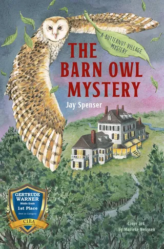 Barn owl flying over a village with houses below
