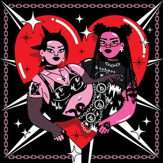 Two goth women with dark makeup and clothing in front of a red heart
