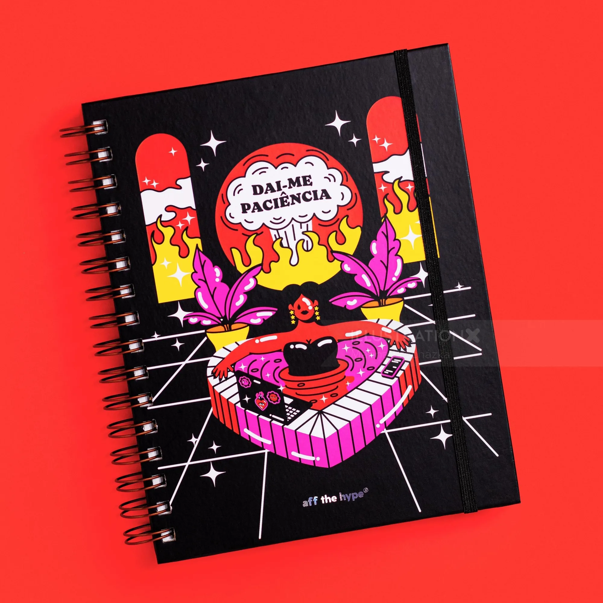 Spiral notebook with colorful surreal illustration and Spanish text cover.