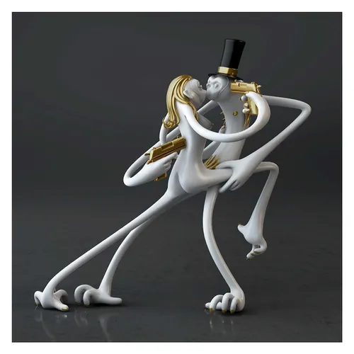 Abstract white and gold sculpture of dancing couple with long limbs