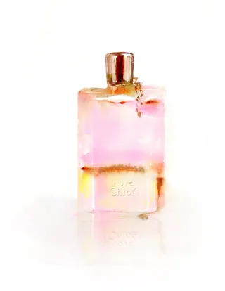 Translucent pink perfume bottle with brass cap by Marta Spendowska