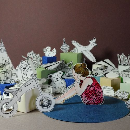 Girl sitting among black-and-white paper animal cutouts by Martha von Maydell