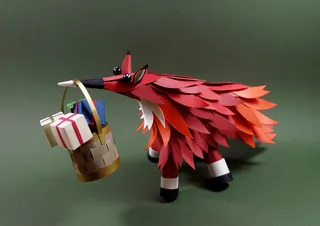 Paper fox sculpture holding a gift basket by Martha von Maydell