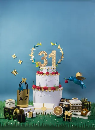 Three-tier birthday cake with gold 21 topper, gifts, and birds by Martha von Maydell