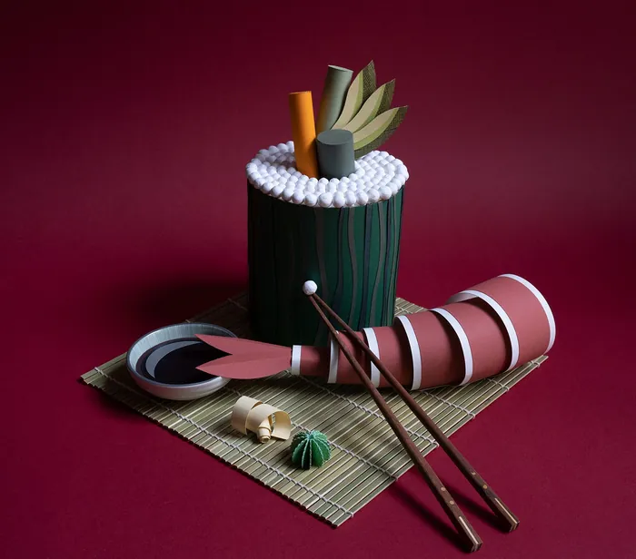 Paper sushi roll with chopsticks and plate in still life by Martha von Maydell