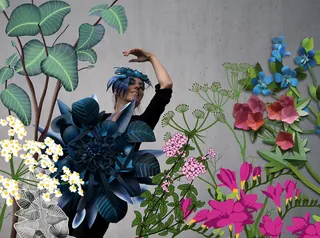 Woman poses among intricate paper flowers and leaves by Martha von Maydell