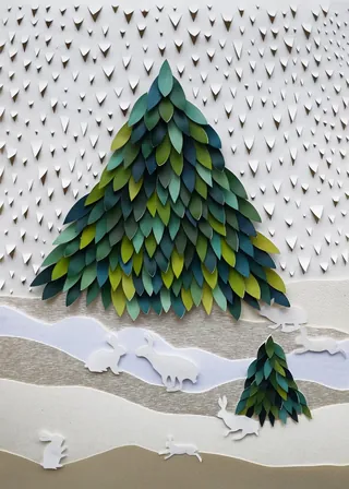 Paper cutout winter scene with pine trees and animals by Martha von Maydell